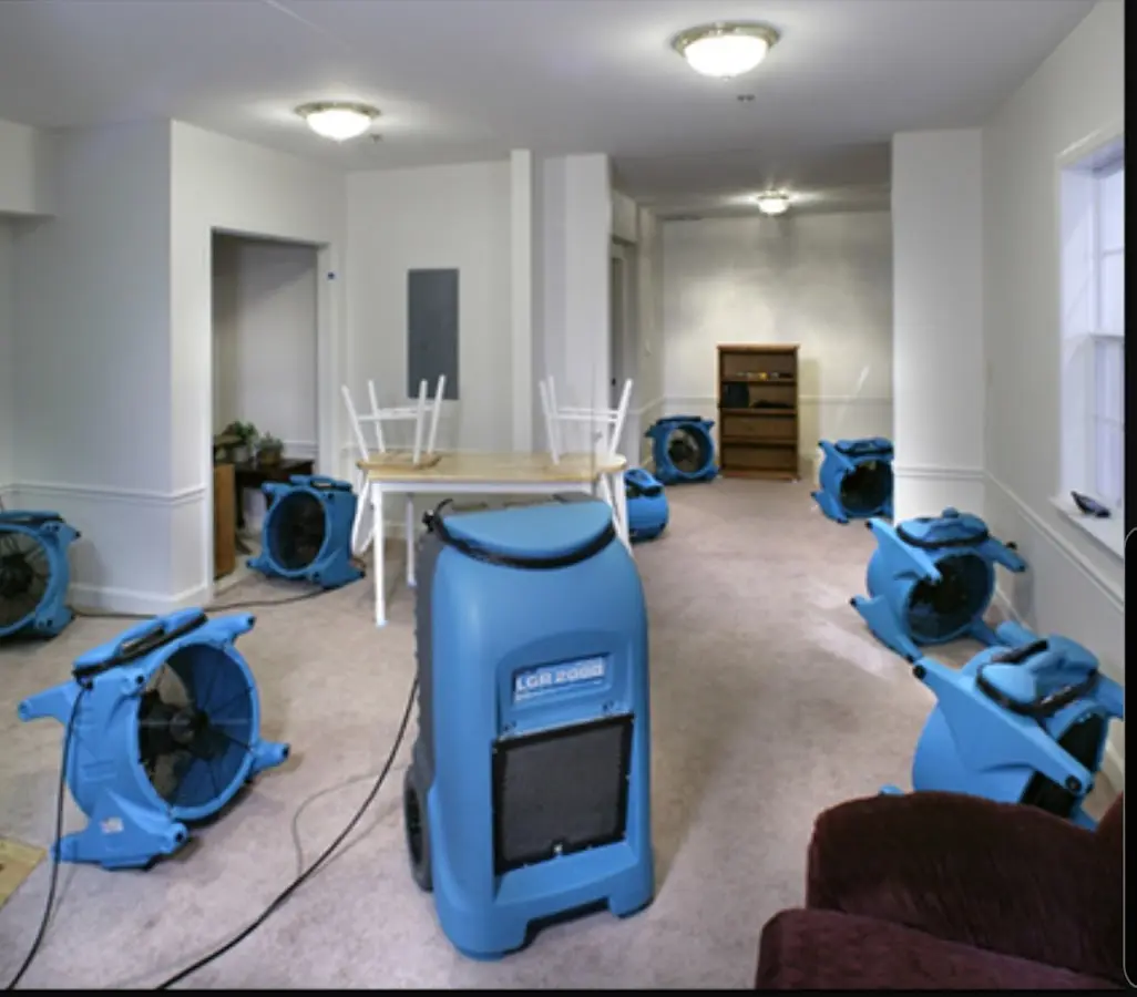 Air movers and dehumidifier setup for Water Damage Restoration in Surf City
